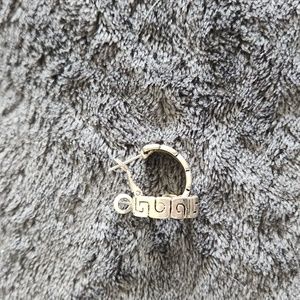 Silver hoop earrings with swirl etching